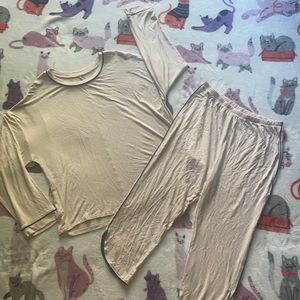 Light pink matching pajama set, slightly see through. No wear or tear.